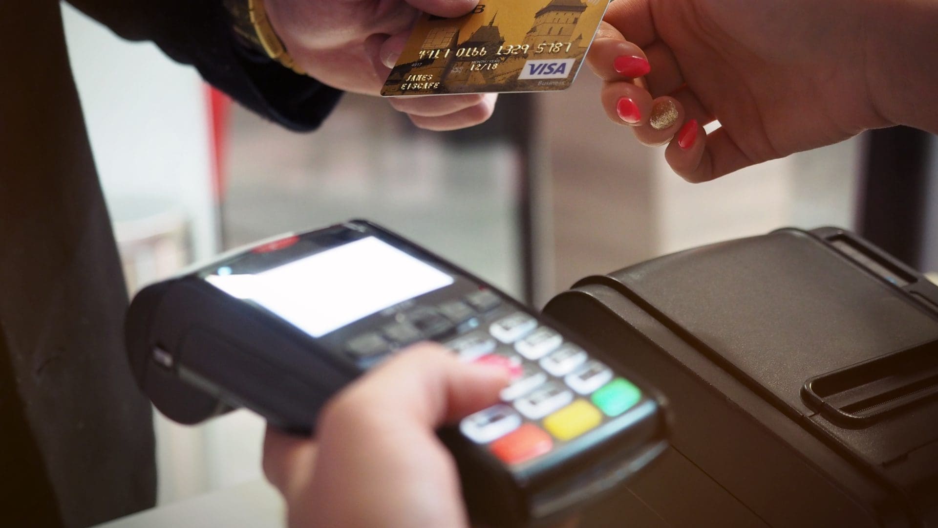 Credit Card Terminal being used by a customer and clerk